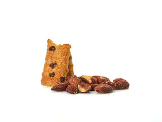 Close up Protein Bar and Almonds bean on white background. Food for energy breakfast, brunch snack, and crackers. Healthy food contains antioxidants nutrients protein, vitamins. Grains nutrition 