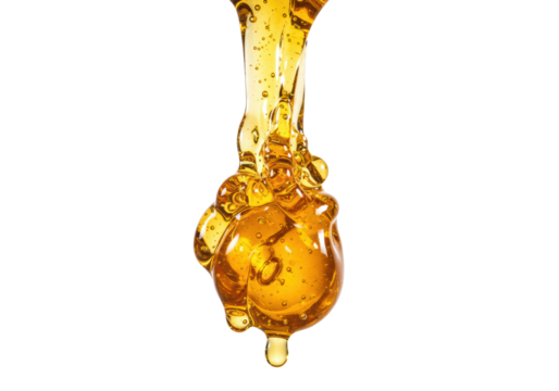 Thick golden viscous honey actively dripping, forming a rich globule with glistening highlights against a transparent studio background with creamy bokeh, concept for luxurious food advertising