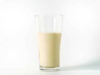 Soy milk in a glass on white background. Healthy drink with vitamins and nutrients. Milk Breakfast isolated. Healthy nutritious food healthcare feeling refreshed. Beverage benefits protein soybeans 