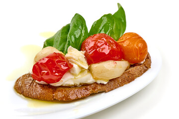 Bruschetta with Tomatoes, Mozzarella and Basil, isolated on white background