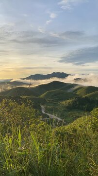 Serene Landscape with Rolling Hills and Fog in Early Morning Light pilok thailand