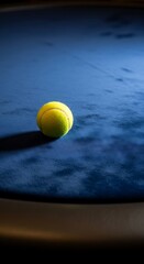 Tennis Ball on Blue - A Study in Texture and Light.