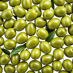 Pile of shiny green olives with leaves, densely packed together
