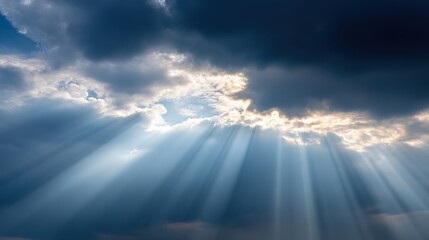 A breathtaking view of dramatic clouds illuminated by rays of sunlight breaking through, creating a serene and uplifting atmosphere.