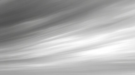A monochromatic abstract image featuring smooth, flowing lines in shades of gray, creating a serene and minimalist atmosphere.