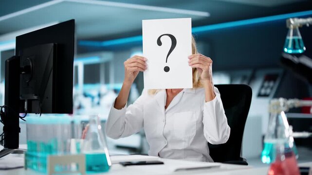 Confused Woman Hiding Behind Question Mark