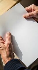 Hands Holding Blank Paper - A Moment of Reflection and Possibility.