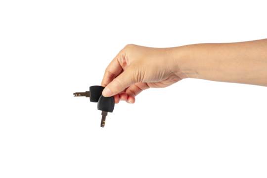 Black locker key in hand on transparent background