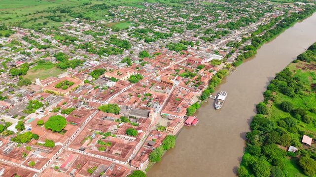 High altitude drone backward footage showing the historic colonial town of mompox on the magdalena river