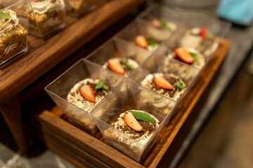 Platter of desserts with strawberries on top