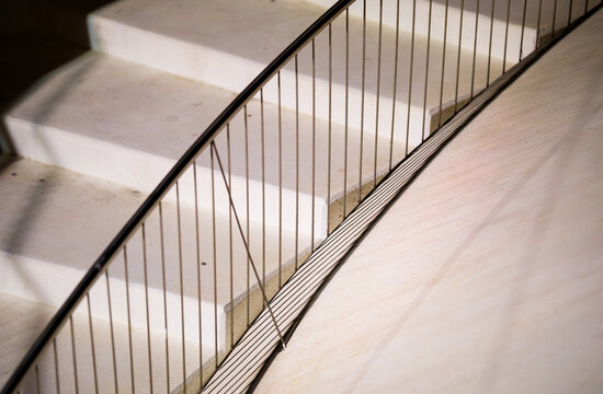 White Steps and Curving Metal Railing Detail
