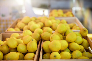 Crates of fresh lemons at outdoor market