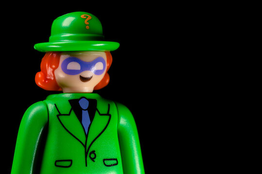 Side view of Kinder Surprise DC The Riddler face on a black background