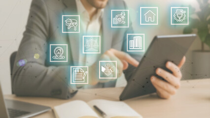 A male businessman manages a real estate business administration system with modern digital innovation technology.