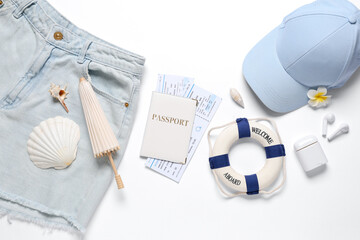 Composition with clothes, passport and tickets on white background, closeup