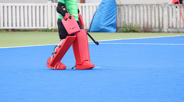 Field hockey goalkeeper with sports equipment. Space for text