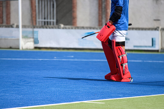 Field hockey goalkeeper with sports equipment - Powered by Adobe
