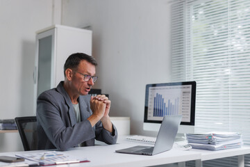 Mature man having remote online video conference call