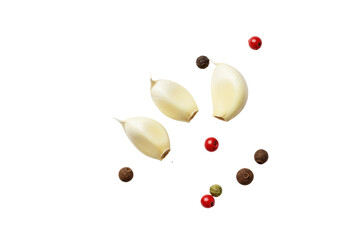 A vibrant green thyme sprig, two peeled garlic cloves, scattered black, pink, green peppercorns and allspice on a transparent background, flat lay culinary freshness