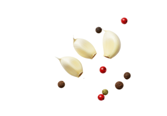 A vibrant green thyme sprig, two peeled garlic cloves, scattered black, pink, green peppercorns and allspice on a transparent background, flat lay culinary freshness