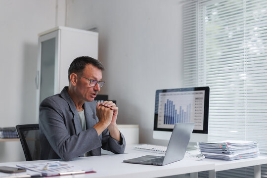 Mature man having remote online video conference call