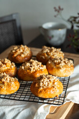 Freshly baked homemade traditional Czech Moravian buns (kolače) with cottage cheese , apple and crumbs on cooling rake.