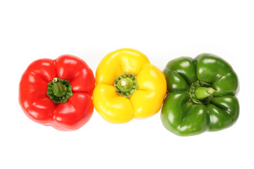 Ripe colorful bell peppers on white background
