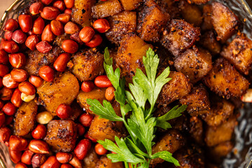 Kelewele, Fried Ripe Plantain Seasoned with Ginger, Cloves, and Pepper, Served with Roasted Groundnuts, a Popular Spicy Ghanaian Snack