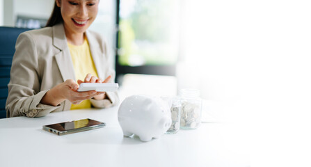 Save smart! Explore financial planning with coins, piggy banks, and digital tools. Perfect for savings, banking, and business in office
