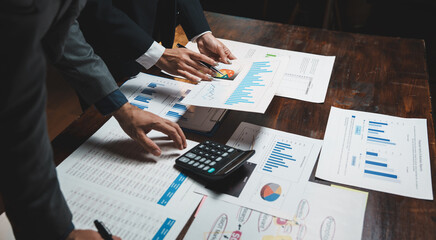 Business professionals analyzing financial reports, planning strategy