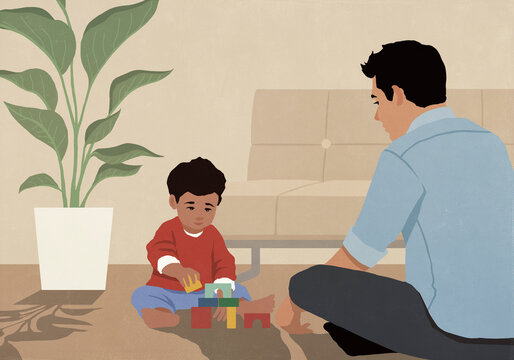 Father and toddler son playing with toys on living room floor at home
