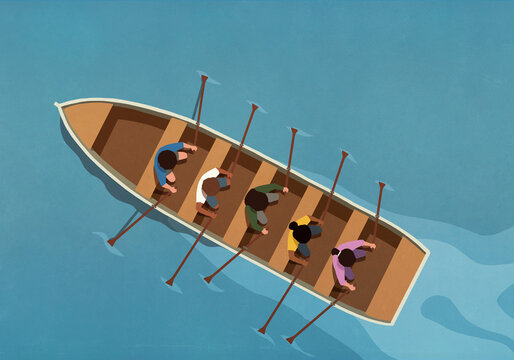 View from above men and women rowing boat backwards on water
