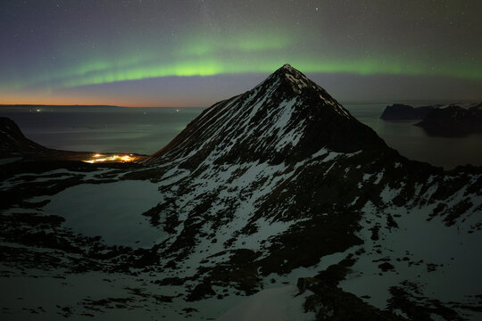 Northern Lights over Myrland and mountains, Lofoten Islands, Norway
