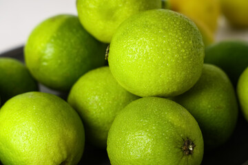 Fresh ripe limes on white background, closeup