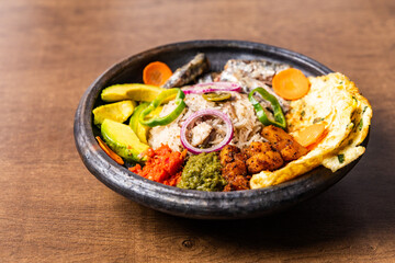 Anwamo (Oiled Rice), Africa Ghana Traditional Dish with Fried Eggs, Sardine, Avocado, and Fried Plantain