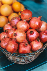 Fresh Pomegranates in Basket at Street Market