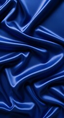 Obraz premium Elegant Blue Silk Fabric with Smooth Waves and Luxurious Texture.