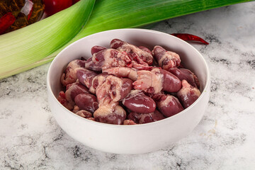 Raw chicken hearts in the bowl