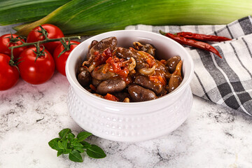 Baked chicken hearts with vegetables