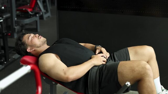 Man Performing Hip Thrust Exercise in Gym