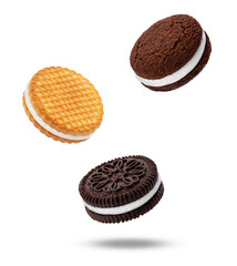 delicious sandwich cookies, including chocolate and waffle biscuits with creamy vanilla filling, falling and isolated on a pure transparent background.
