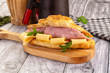 Fresh croissant with ham and cheese