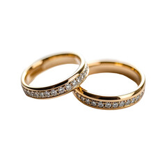 Gold wedding rings with diamond accents, elegantly displayed on a black background