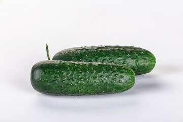 Ripe green raw two cucumbers