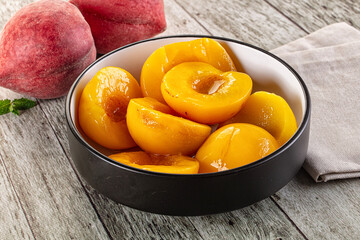 Sweet ripe yellow canned peaches