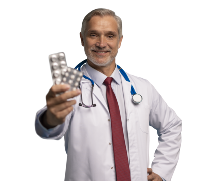 Cheerful mature male doctor holding pills in white lab coat with stethoscope, on transparent background