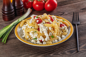 Italian pasta fusili with curd