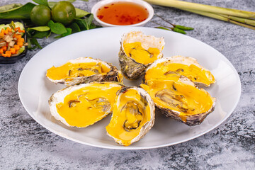 Baked oyster with cheddar cheese