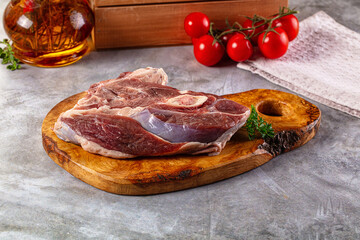 Raw lamb steak with bone