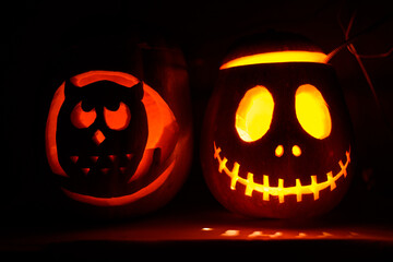 Jack-o'-lantern and owl pumpkin carving glowing halloween night